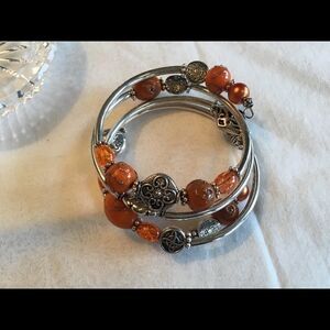 $10 ea or 3/$20. Silvertone Orange Beads Coil Brac